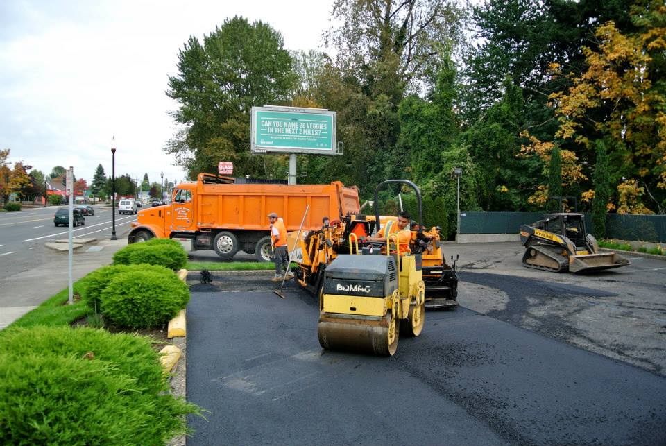 Crews at work paving a commercial parking lot to help illustrate asphalt paving Portland OR and What Is the Asphalt Paving Process?