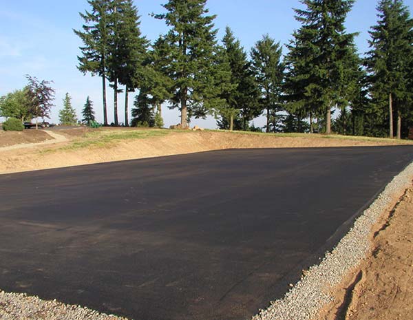 Freshly paved asphalt RV pad built to hold heavy vehicles
